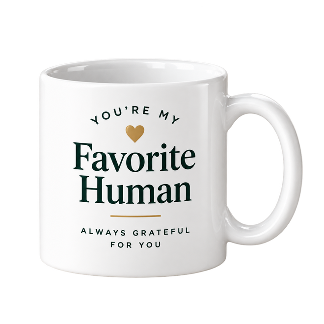 White mug with the words You’re My Favorite Human in dark green and a small gold heart.